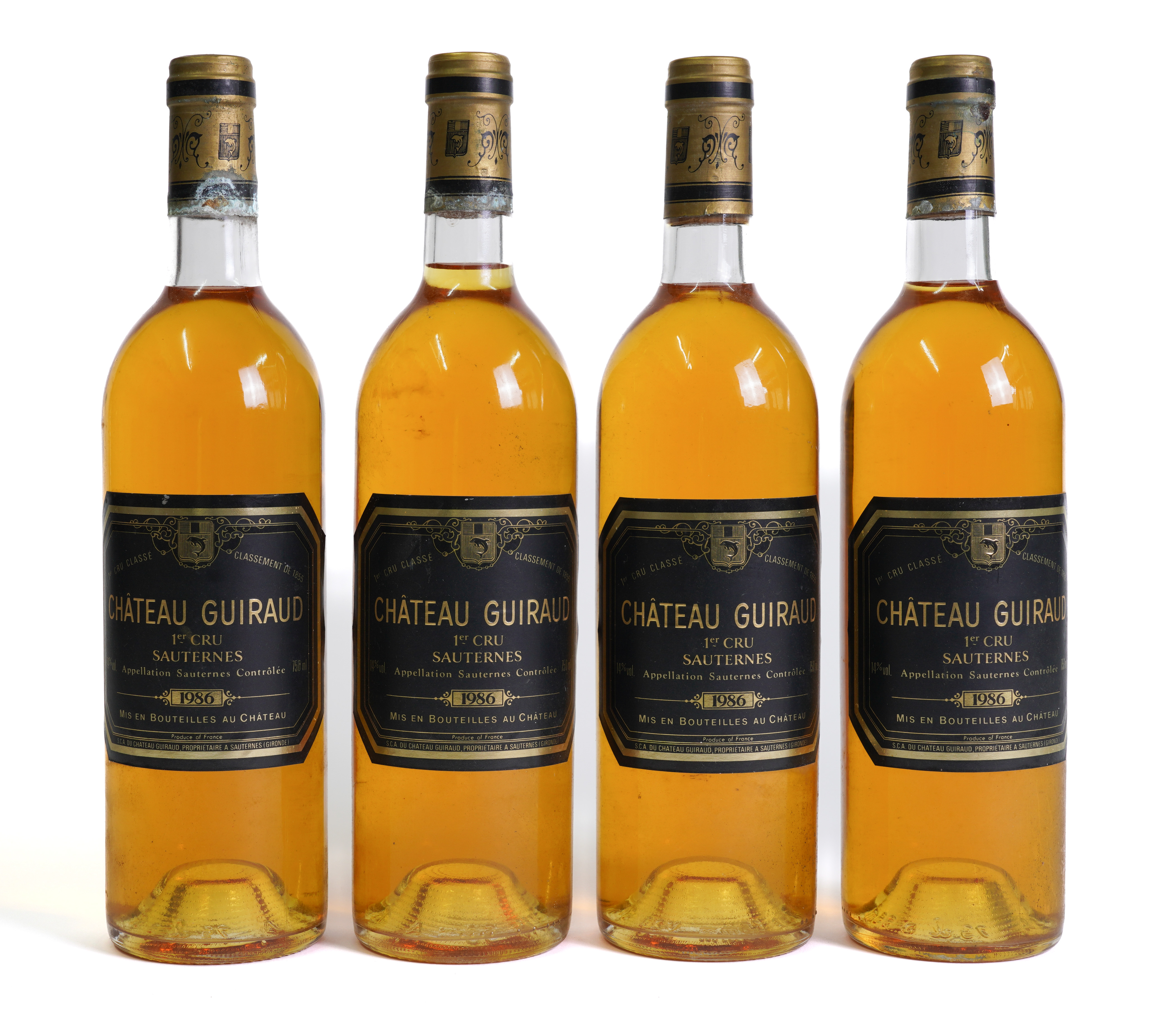 FOUR BOTTLES OF CHATEAU GUIRAUD PREMIERE CRU SAUTERNES 1986 (4)