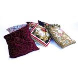A GROUP OF SIX CUSHIONS INCLUDING FOUR WOOLWORK EXAMPLES (6)