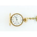 AN 18K GOLD TURKISH MARKET KEYLESS WIND HUNTING CASED FOB WATCH WITH A GILT METAL WOVEN FOB...