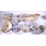 A GROUP OF THIRTY 19TH CENTURY AND LATER CERAMIC JELLY MOULDS (30)