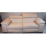 A MODERN FAUX WHITE LEATHER TWO SEATER RECLINING SOFA