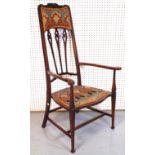 AN EARLY 20TH CENTURY LIBERTY’S STYLE HIGHBACK ARMCHAIR