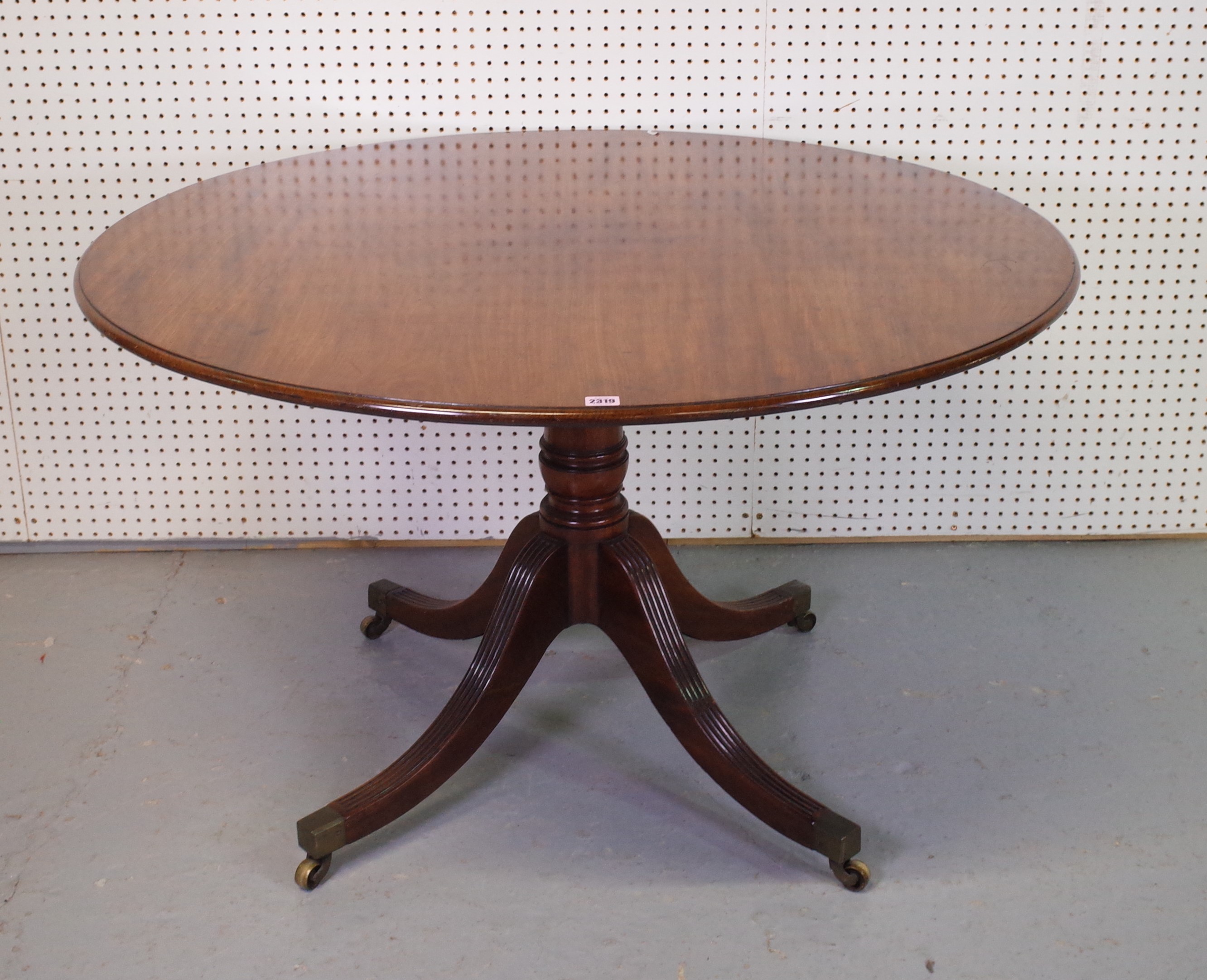 A MAHOGANY CIRCULAR BREAKFAST TABLE