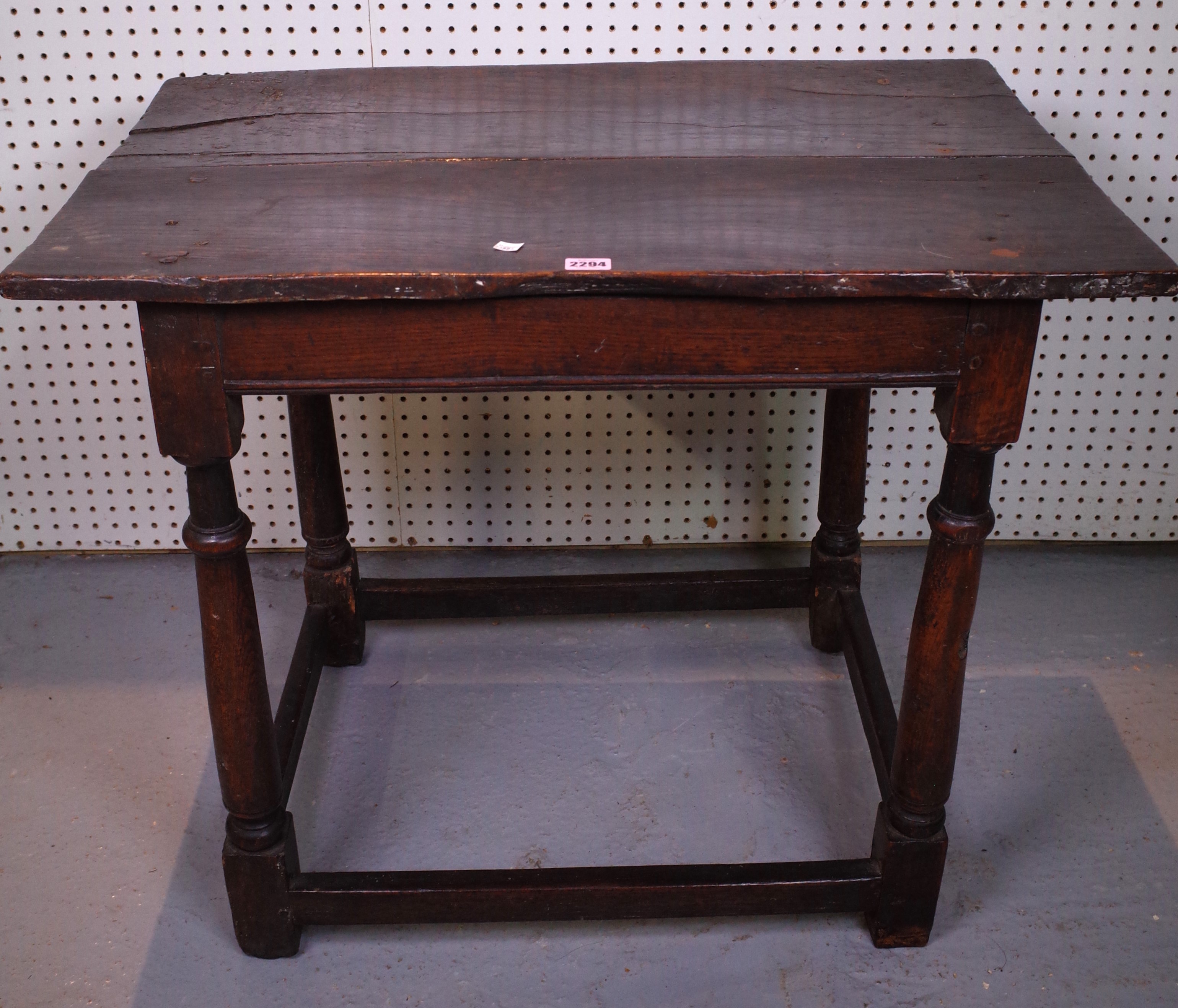 A 17TH CENTURY AND LATER OAK SIDE TABLE ON TURNED SUPPORTS