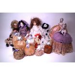 AN EXTENSIVE COLLECTION OF MOSTLY 19TH CENTURY CERAMIC PIN CUSHION DOLLS