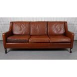 A MID 20TH CENTURY LEATHER UPHOLSTERED THREE SEAT SOFA
