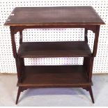 IN THE MANNER OF LIBERTYS; AN EARLY 20TH CENTURY MAHOGANY THREE TIER OCCASIONAL TABLE