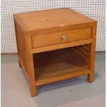 A MODERN OAK LOW SIDE TABLE WITH LATTICE WORK SIDES.