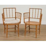 A PAIR OF LATE 19TH CENTURY POLYCHROME PAINTED FAUX BAMBOO OPEN ARMCHAIRS (2)