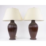 A PAIR OF BRONZE PATINATED METAL FLUTED BALUSTER TABLE LAMPS (2)