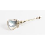 A SILVER AND GILT SPOON BY STUART DEVLIN