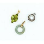 A PERIDOT PENDANT AND TWO FURTHER PENDANTS (3)