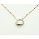 A GOLD AND MOONSTONE SINGLE STONE PENDANT NECKLACE