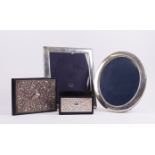 TWO SILVER MOUNTED PHOTOGRAPH FRAMES AND TWO SILVER MOUNTED DESK ACCESSORIES