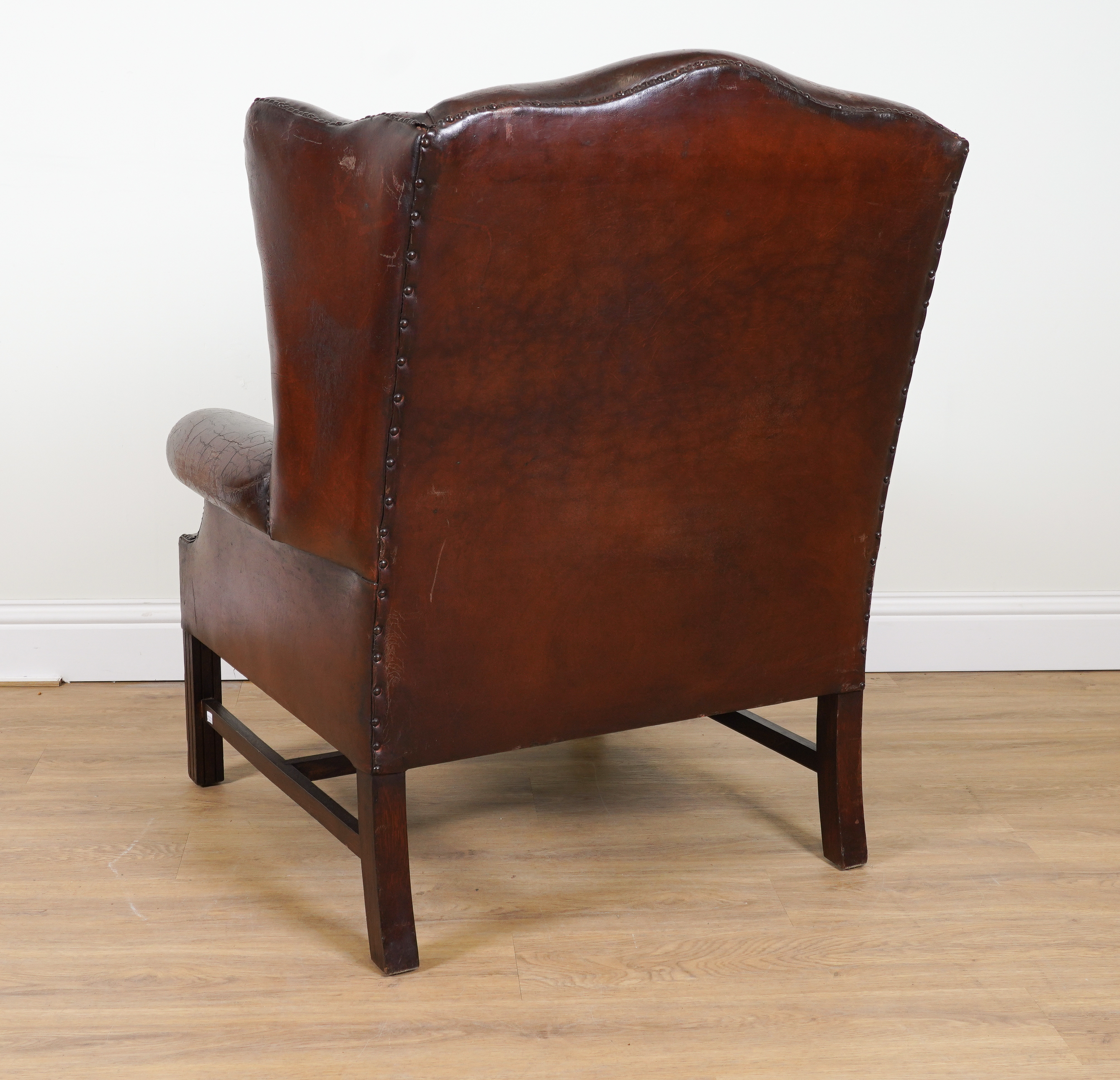 A GEORGE II STYLE STUDDED TAN LETAHER UPHOLSTERED WINGBACK ARMCHAIR - Image 2 of 3