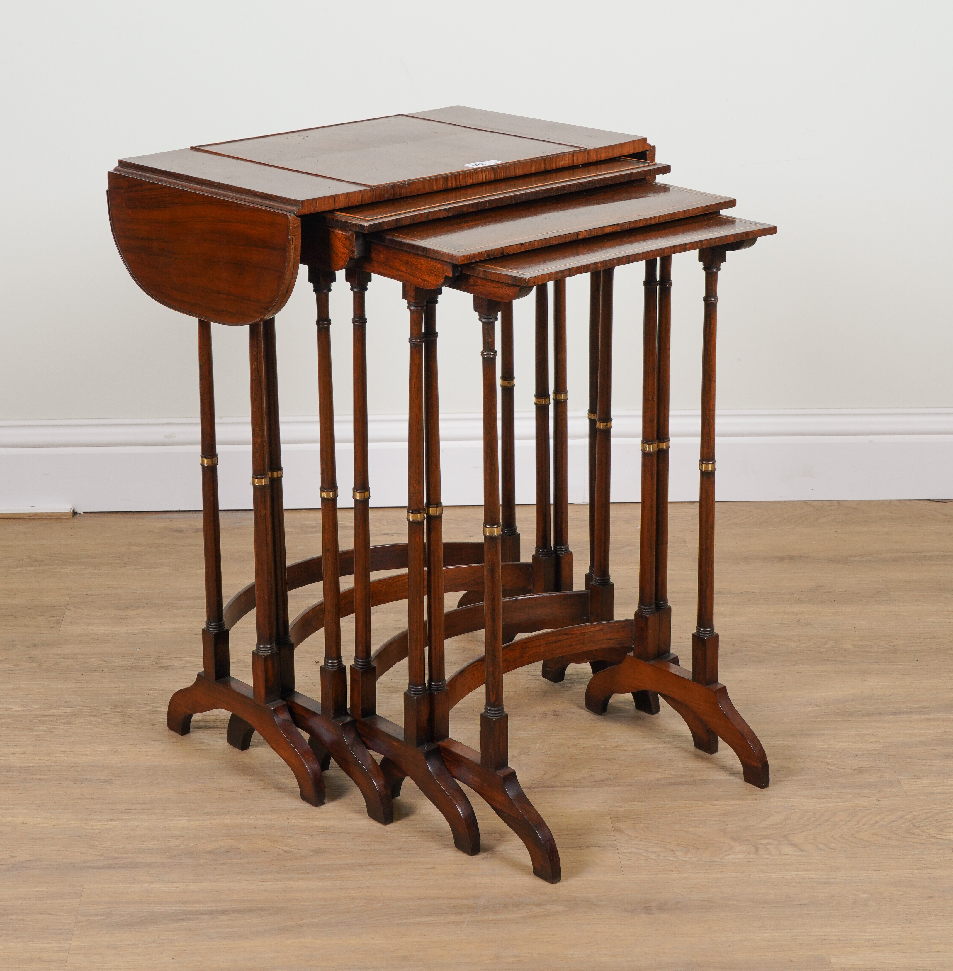 A NEST OF FOUR MID-19TH CENTURY GILT-METAL MOUNTED ROSEWOOD OCCASIONAL TABLES (4)