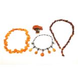 A SINGLE ROW NECKLACE OF AMBER BEADS AND THREE FURTHER ITEMS (4)