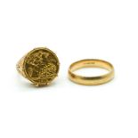 A HALF SOVEREIGN RING AND A 9CT GOLD PLAIN BAND RING (2)