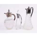 A LATE VICTORIAN SILVER MOUNTED CLARET JUG AND TWO FURTHER PLATED METAL MOUNTED JUGS (3)