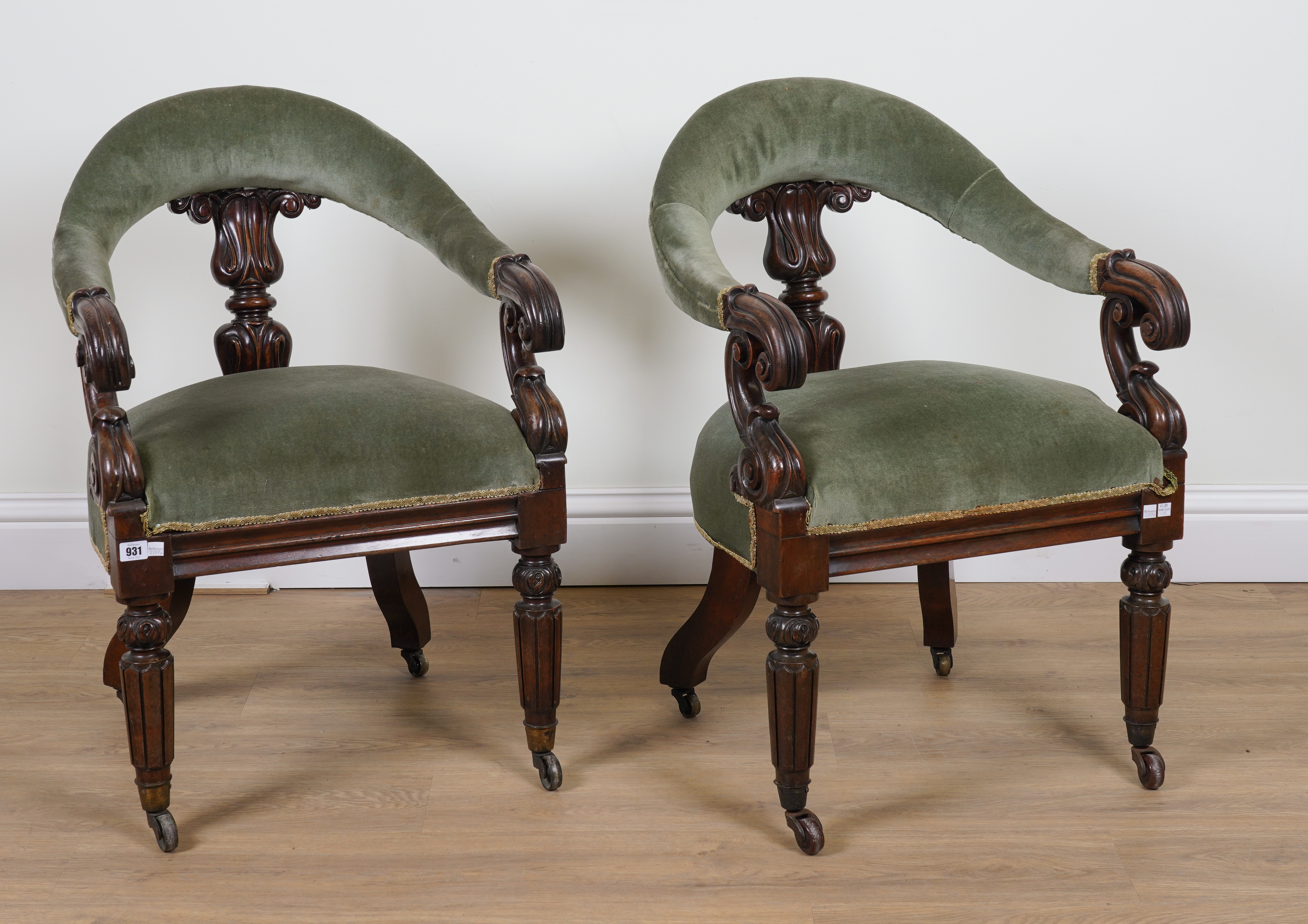 A PAIR OF EARLY VICTORIAN CARVED ROSEWOOD FRAMED TUB BACK DESK CHAIRS (2)