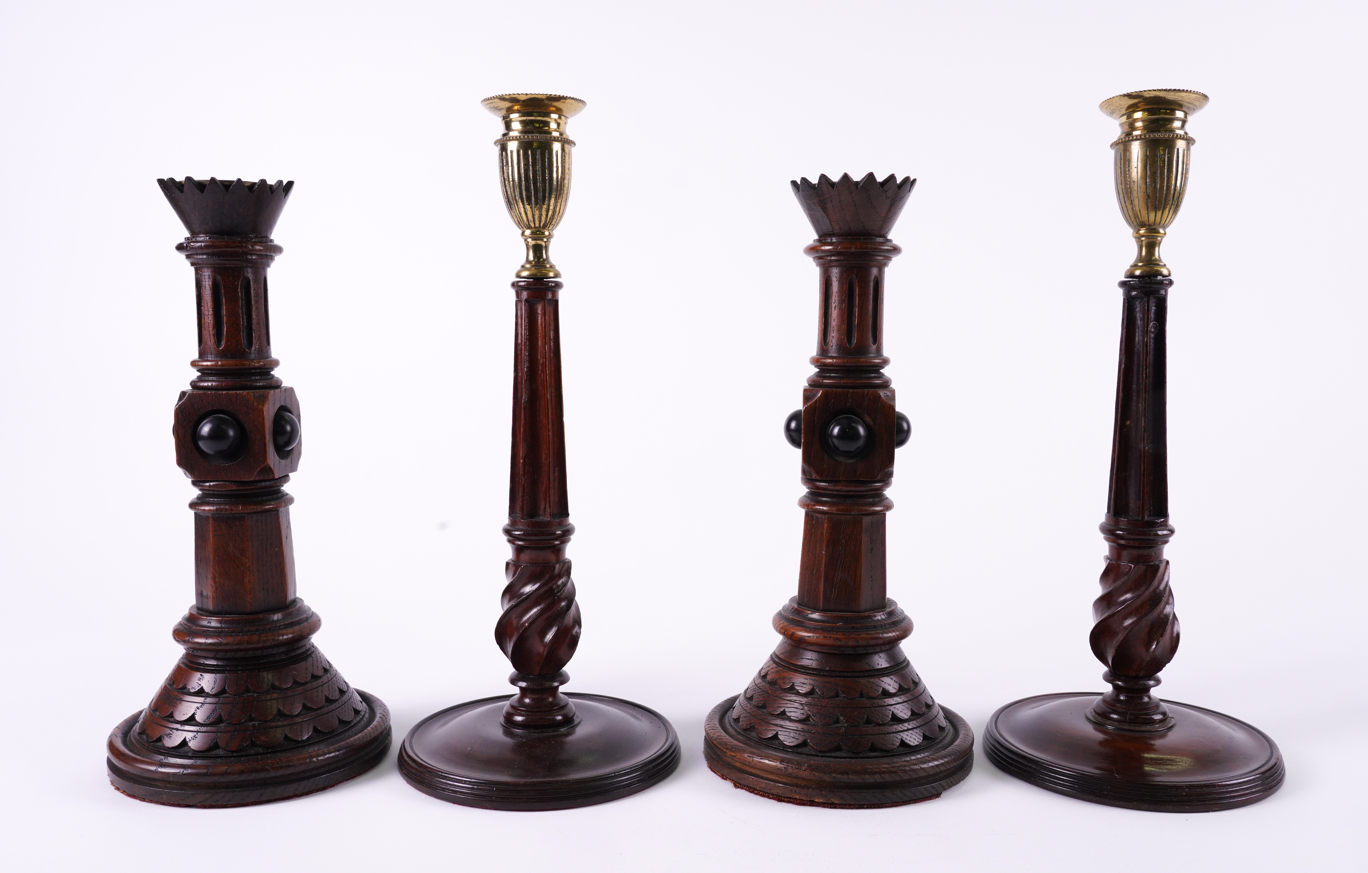 A PAIR OF VICTORIAN GOTHIC REVIVAL OAK CANDLESTICKS (4) - Image 2 of 2