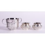 A BRITANNIA STANDARD LATE QUEEN ANNE SILVER TWIN HANDLED PORRINGER AND PAIR OF SILVER SALTS (3)