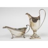 A SILVER CREAM JUG AND A SILVER SAUCEBOAT (2)