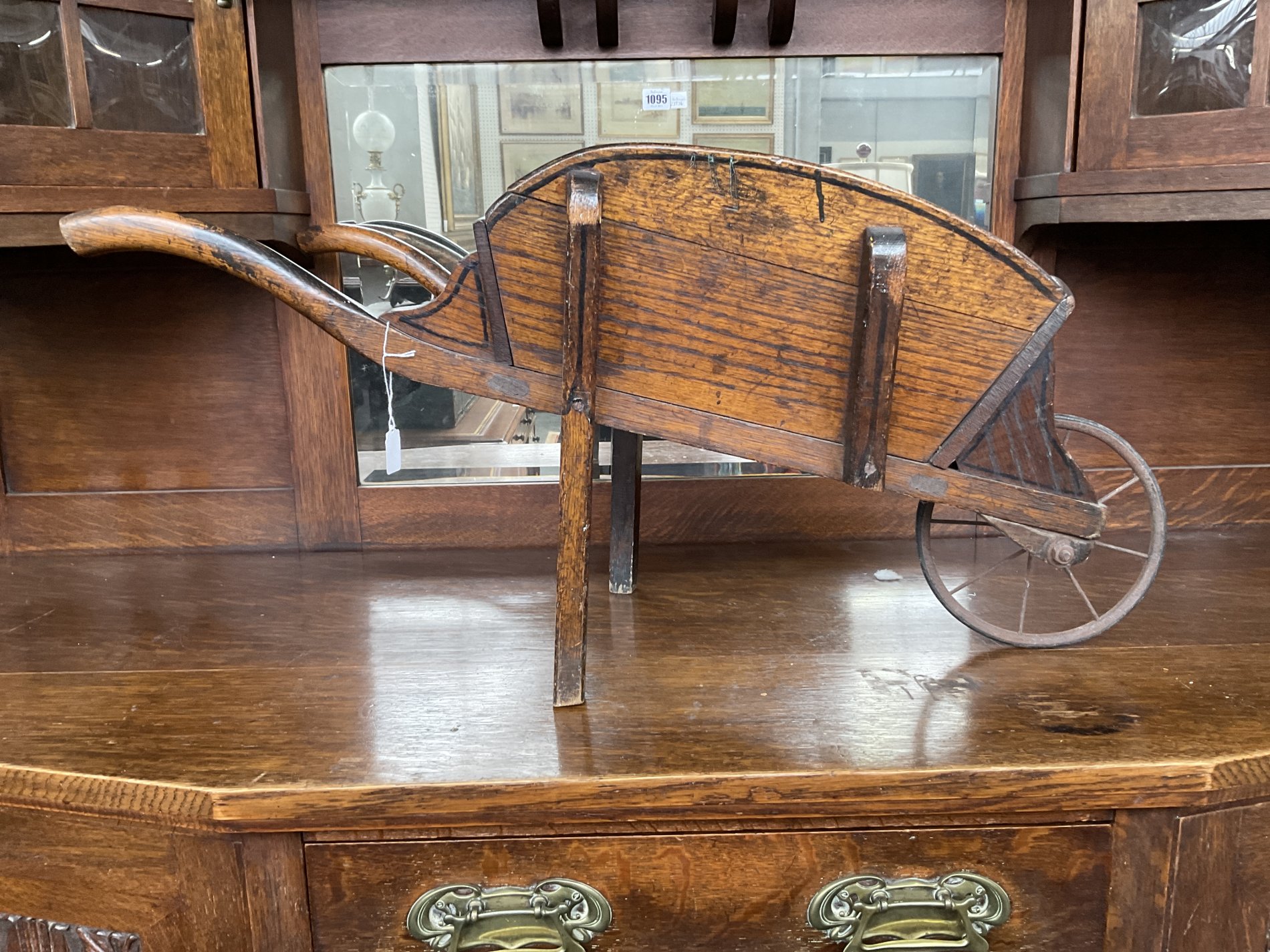 A LATE VICTORIAN MAHOGANY AND BRASS MOUNTED TABLE WHEEL BARROW AND AN ELM CHILD’S WHEEL BARROW... - Image 3 of 5