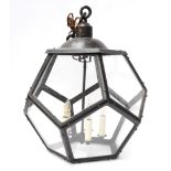 A LARGE BLACK LACQUERED METAL FACETED HANGING LIGHT
