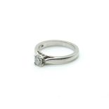 A PLATINUM AND DIAMOND SINGLE STONE RING