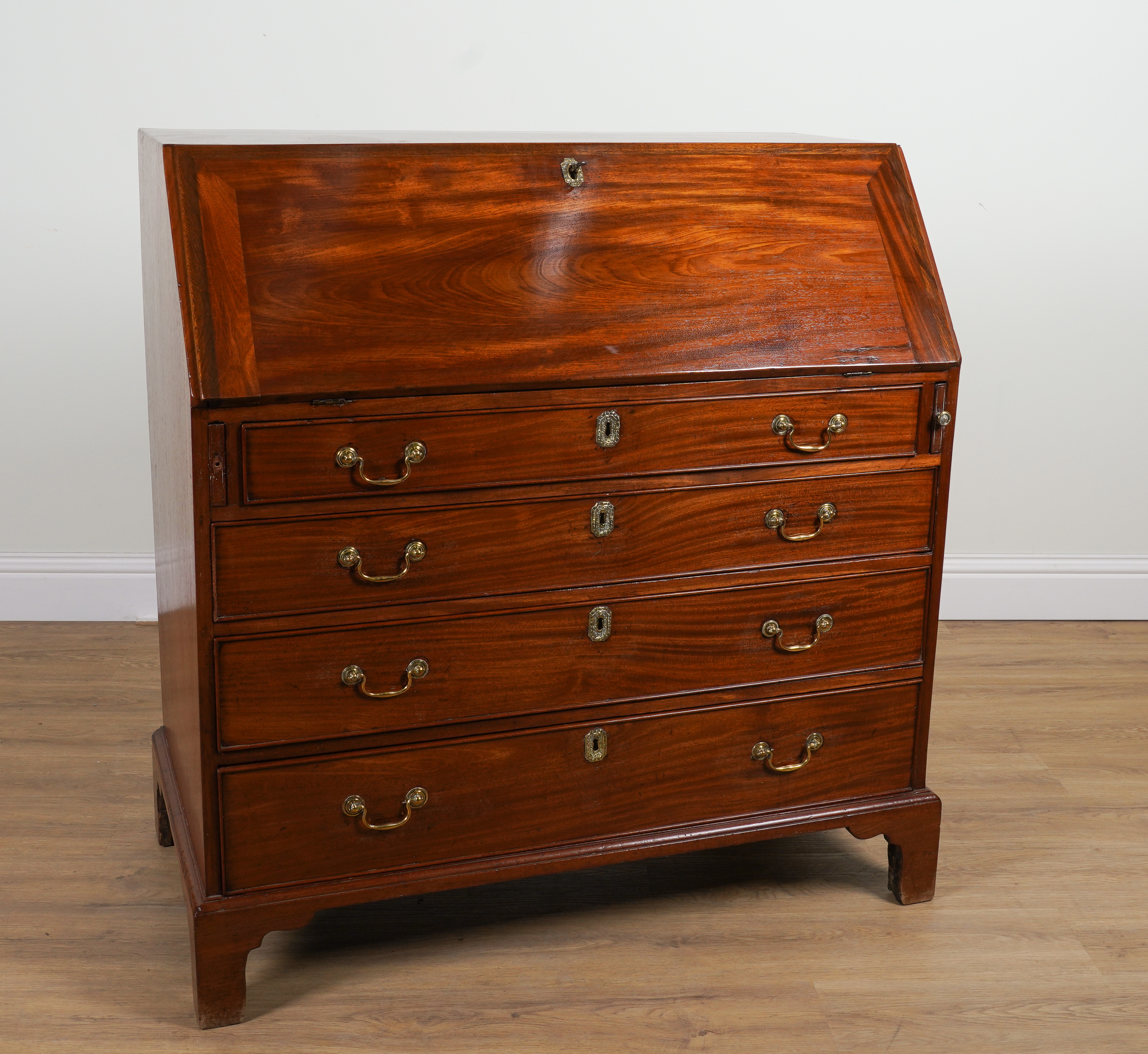 A GEORGE III MAHOGANY FOUR DRAWER BUREAU