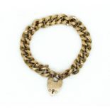 A GOLD CURB LINK BRACELET