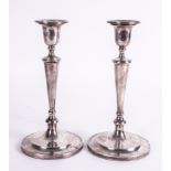 A PAIR OF SILVER TABLE CANDLESTICKS