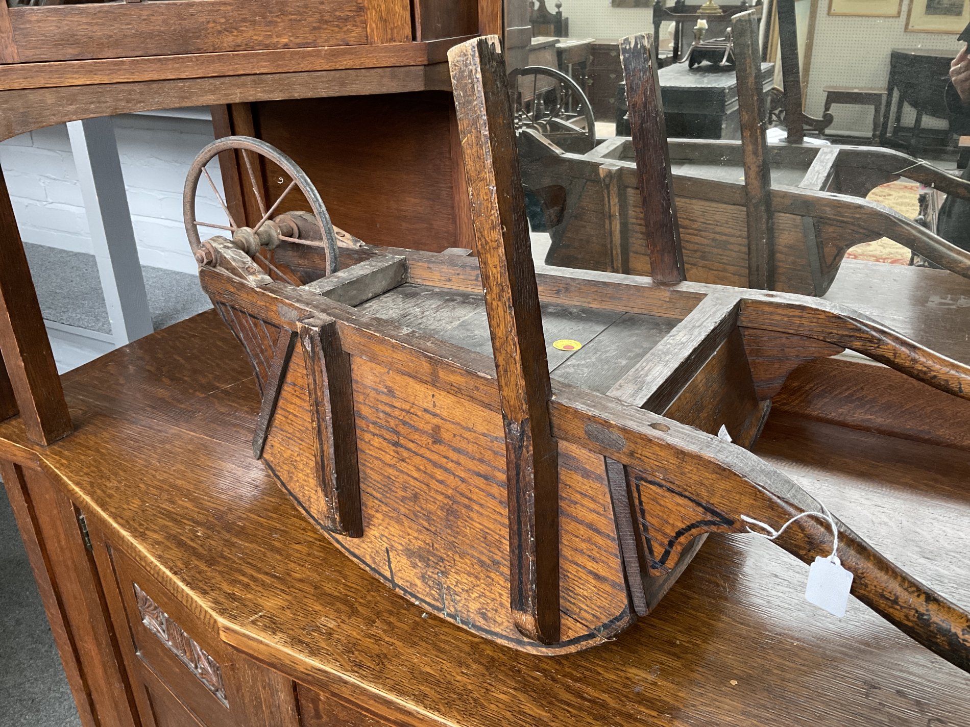 A LATE VICTORIAN MAHOGANY AND BRASS MOUNTED TABLE WHEEL BARROW AND AN ELM CHILD’S WHEEL BARROW... - Image 2 of 5