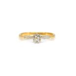 A GOLD AND PLATINUM DIAMOND SINGLE STONE RING