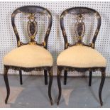 A PAIR OF VICTORIAN PARCEL GILT BLACK LACQUER SPOON BACK SIDE CHAIRS (2)