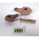 TWO MINIATURE TERRACOTTA OIL LAMPS AND A MUMMY ORNAMENT (3)