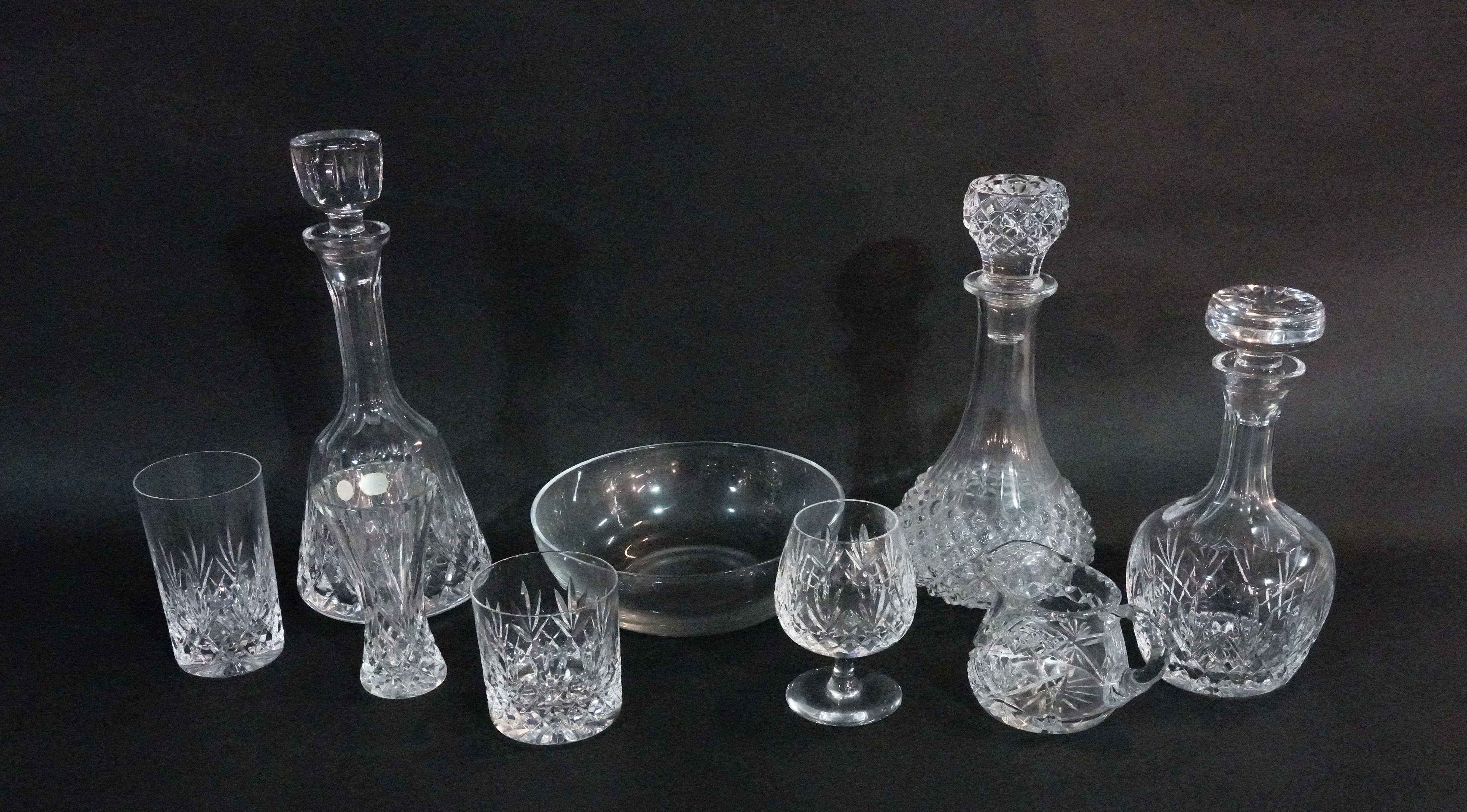 A QUANTITY OF CRYSTAL DRINKING GLASSES, SOME WATERFORD AND OTHERS