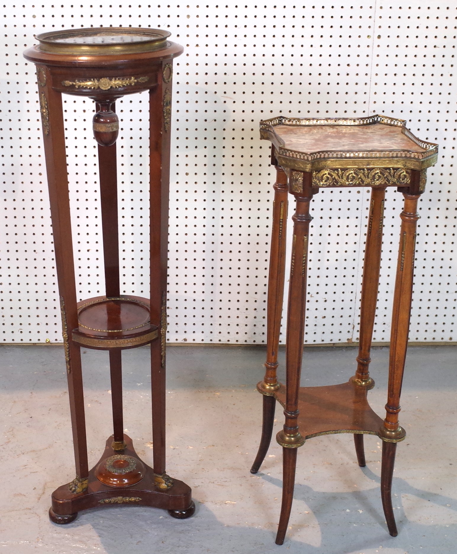A FRENCH EMPIRE STYLE GILT METAL MOUNTED MAHOGANY AND MARBLE CIRCULAR TWO TIER STAND (2)