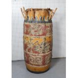 A TRIBAL STYLE HARDWOOD FLOOR STANDING DRUM