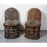 A PAIR OF TRIBAL STYLE HARWOOD CHAIRS (2)