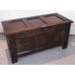 A 17TH CENTURY CARVED OAK SIX PANEL COFFER