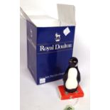 A ROYAL DOULTON ADVERTISING FIGURE FOR PENGUIN BOOKS