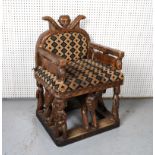 A TRIBAL STYLE HARDWOOD ARMCHAIR