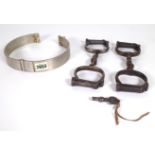 A PAIR OF VICTORIAN STEEL HANDCUFFS, ANOTHER PAIR AND A COLLAR (3)