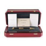 A CARTIER GILT METAL MOUNTED LIMITED EDITION CALENDAR BALL POINT PEN, WITH WATCH