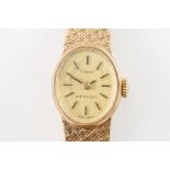 A TISSOT STYLIST 9CT GOLD BRACELET WRISTWATCH