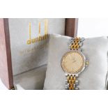 A DUNHILL QUARTZ GENTLEMAN'S GOLD, STEEL AND DIAMOND SET DRESS WRISTWATCH