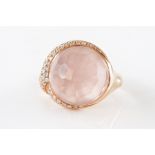 A ROSE QUARTZ AND DIAMOND RING