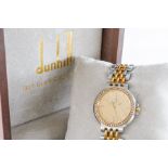 A DUNHILL QUARTZ LADY'S GOLD, STEEL AND DIAMOND SET DRESS WRISTWATCH